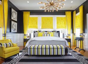 a bedroom with a bed and a yellow chair at Pandora's Manor in High Point