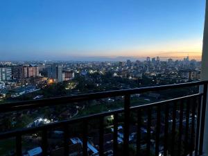 a view of a city at night from a balcony at Casa Almasi in Nairobi