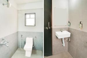 a bathroom with a toilet and a sink at Super Townhouse Lohegaon Near Pune Airport Formerly Landmark Regency in Pune