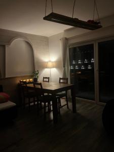 a dining room table and chairs in a room at Stylish & Spacious Apartment with Patio in Stams +22 photos