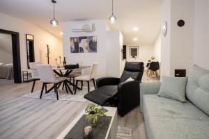 a living room with a couch and a table at Fort Vista in Knin