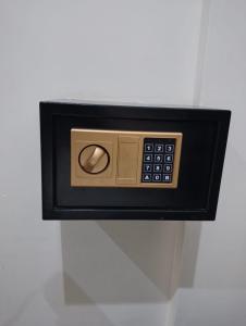 a soap dispenser attached to a wall at درر مسك للشقق المخدومة in Hail +4 photos