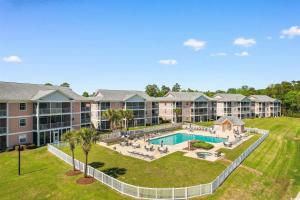 an aerial view of an apartment complex with a swimming pool at Myrtle Beach Waterway Getaway in Myrtle Beach
