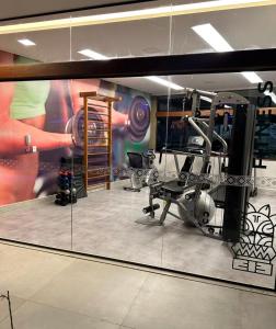 a reflection of a gym in a mirror at Mana Beach Experience in Ipojuca