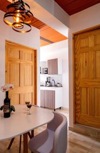 a dining room with a table and a wine glass at Apartamento clásico Riosucio in Ruiosucio +16 photos