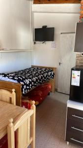 a room with two beds in a room at Loft Don Manuel in Trelew +5 photos