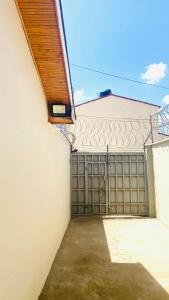 a garage door with a gate in a building at Urban Host Buru Prime 1BR Luxe in Nairobi