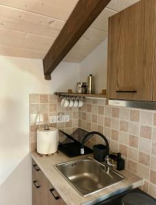 a kitchen with a sink and a counter top at Hestia loft in Nafplio