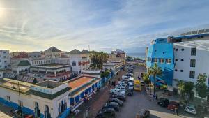 an overhead view of a city street with cars parked at Central Premium Holiday Homes - Marché, Corniche & Océan à pied in Larache