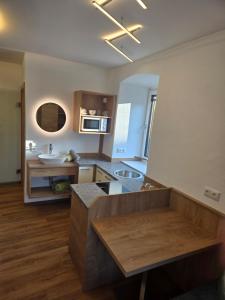 a large kitchen with a sink and a counter at Landhof Harrauer in Erlauf