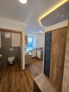a bathroom with a toilet and a sink at Landhof Harrauer in Erlauf