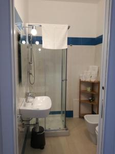 a bathroom with a shower and a sink and a toilet at N'amuri Residence in Castellammare del Golfo +54 photos