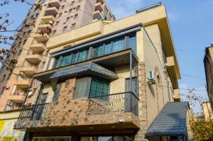 a building with a balcony on the side of it at 31Mesrop Mashtots Avenu in Yerevan
