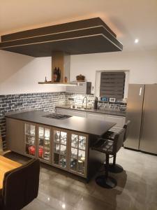 a kitchen with a large island in the middle at Traumhaus in der Eifel in Hellenthal