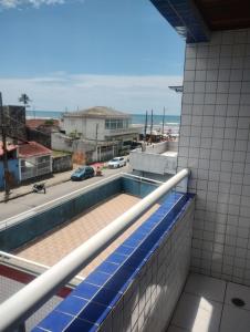 a view from the balcony of a building with a swimming pool at Apto mongagua in Mongaguá