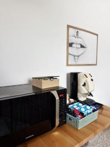 a microwave sitting on top of a wooden table at B&B da Matteo in Telese +33 photos