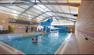 a group of people in a swimming pool at Quince in Ferndown