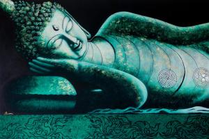 a statue of a woman is sitting on a table at ELEGANT Kata sea View Apartmens in Kata Beach