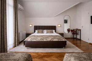 a bedroom with a large bed in a room at Motel Marić in Žepče