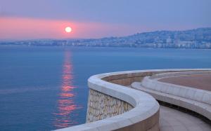 a sunset over a large body of water at "Le Zen" by EnjoyNice, central spacious apartment with Airco, beach at 10 min in Nice