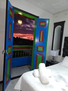 a room with a bed and a door with a view at Casa Boutique Hotel in Salento