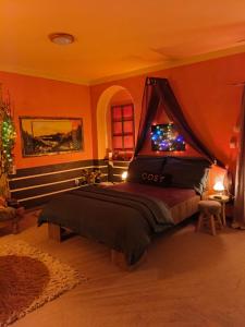 a bedroom with a bed with a canopy at Pension Relax in Litoměřice
