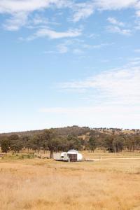 a barn in the middle of a field at Captain Moonlite Bubbletent at Mirumiru in Tenterfield +19 photos