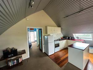 an overhead view of a kitchen with white appliances at Blue Monkey Mountains in Newnes Junction