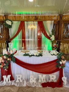 a table set up for a wedding with flowers at Sunshine Cabanas At Ocean View in Dangriga