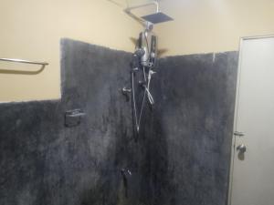 a shower stall in a bathroom with a shower head at Sehandi Hotels - Renaissance Ella in Ella