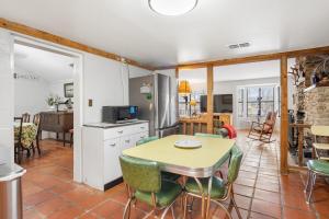 a kitchen and dining room with a table and chairs at Guadalupe Getaway in Kerrville