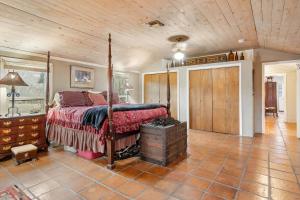 a bedroom with a bed and a wooden ceiling at Guadalupe Getaway in Kerrville