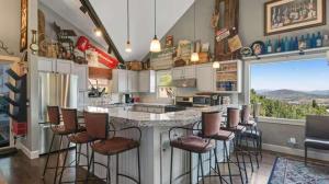 a kitchen with a large island with bar stools at Side-by-Side Homes Multi-level with Views Ski Trail in Park City
