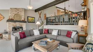 a living room with a couch and a fireplace at Ridge Home Multi-level with PC Views Ski Trail in Park City