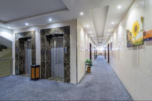a hallway in a building with a hallway sidx sidx sidx at Alqasr Almutar Hotel in Abha