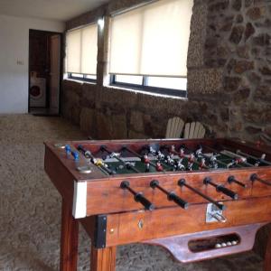 a wooden foosball table in a room at Quinta da Raiz in Canedo de Basto