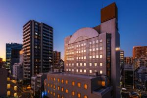 a view of a large building in a city at HOTEL MYSTAYS Ueno East in Tokyo