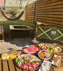a table with many different types of food on it at グランコテージベンガルの森 in Nasu +28 photos