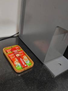 a candy bar sitting next to a laptop computer at Annaz Suite Crown Pacific in Bintulu
