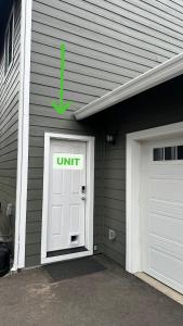 a garage with a unit sign on the door at Studio in North Bend in North Bend