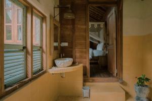 a bathroom with a sink and a window at Green vanilla mincung 2 in Silebeng +46 photos