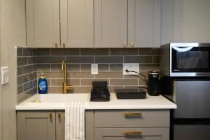 a kitchen with a sink and a microwave at Studio in North Bend in North Bend