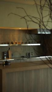 a kitchen with a counter top and a counter top at 雲居月-kumoizuki- in Ginowan