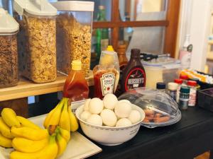 a counter with eggs and bananas and other ingredients at Lodge GRAMP アルプスの見える隠れ家 in Omachi