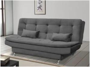 a couch in a living room with two pillows on it at Loft Gracas Inn in Recife