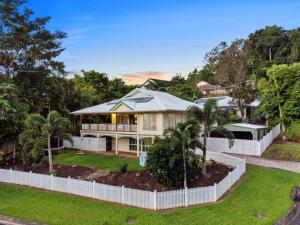 an aerial view of a house with a white fence at Kalani - The Heavens View House in Freshwater