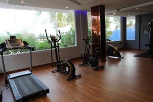 a gym with treadmills and exercise bikes in a room at Primula Beach Hotel in Kuala Terengganu