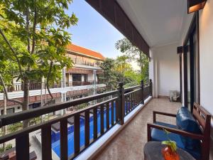 a balcony with a view of a building at Emerald Angkor Siem Reap in Siem Reap