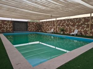 an overhead view of a swimming pool with a tent at NMY Farm1 in Ras al Khaimah +36 photos