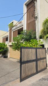 a wooden gate in front of a building at Sea esta villa in Mount Lavinia